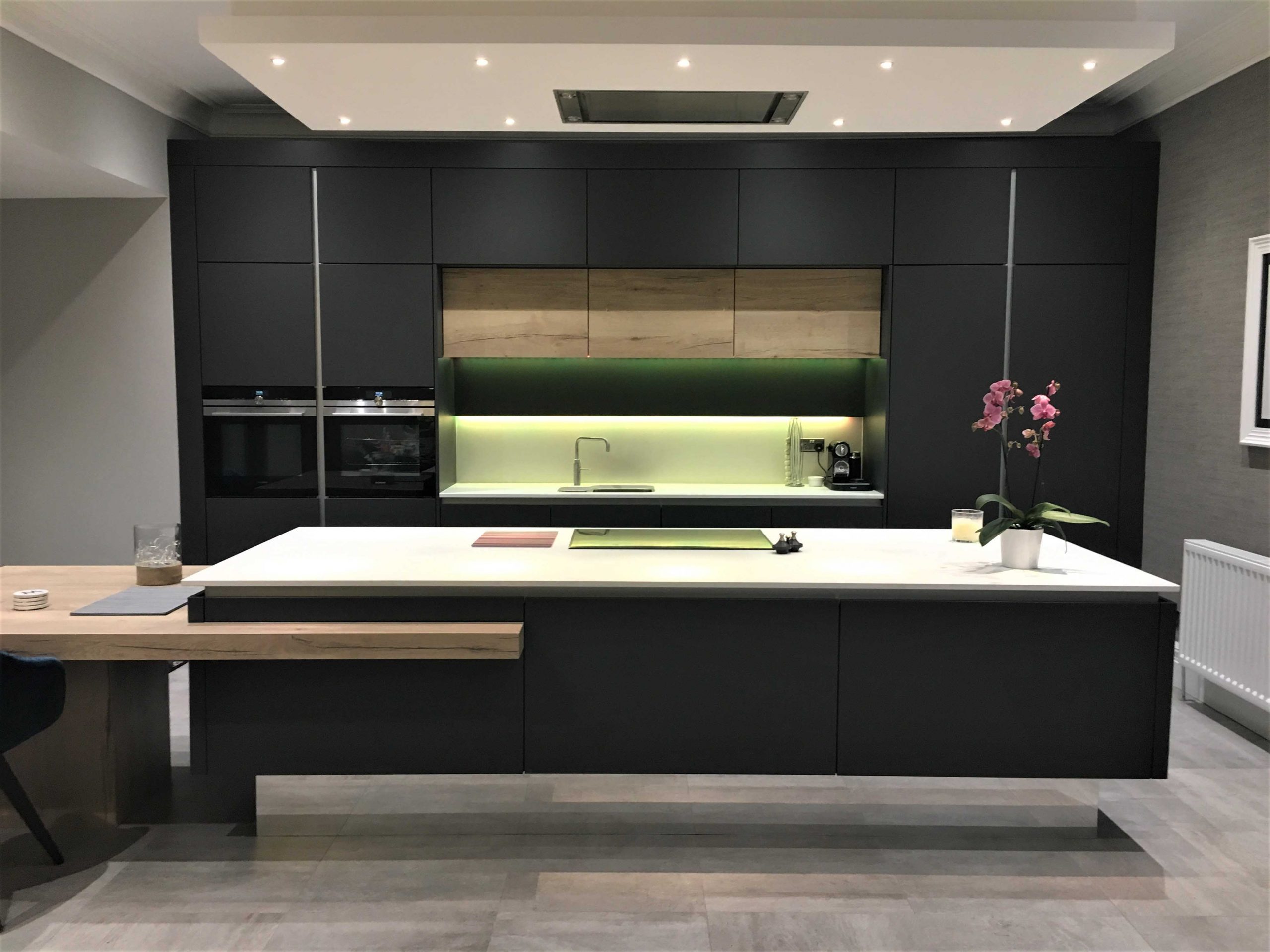 contemporary extended height kitchen with large island and integrated breakfast table