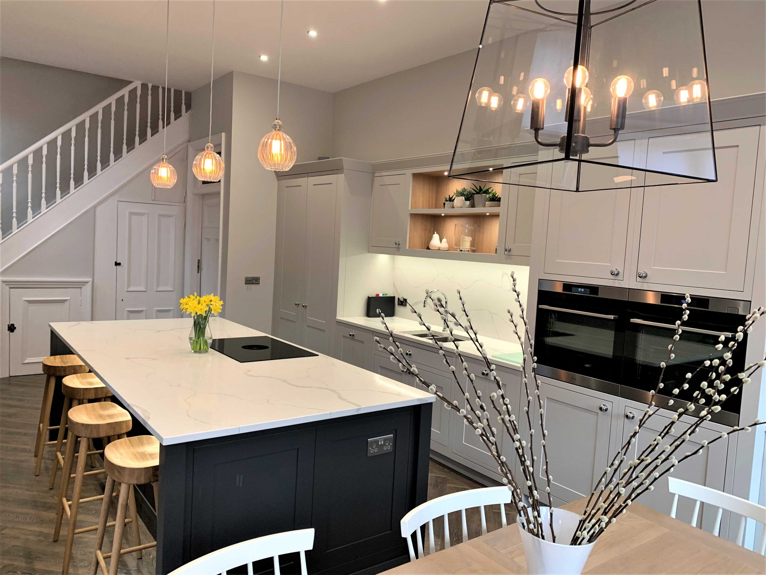 in frame bespoke painted shaker with contrasting island calacatta viened stone worksurfaces