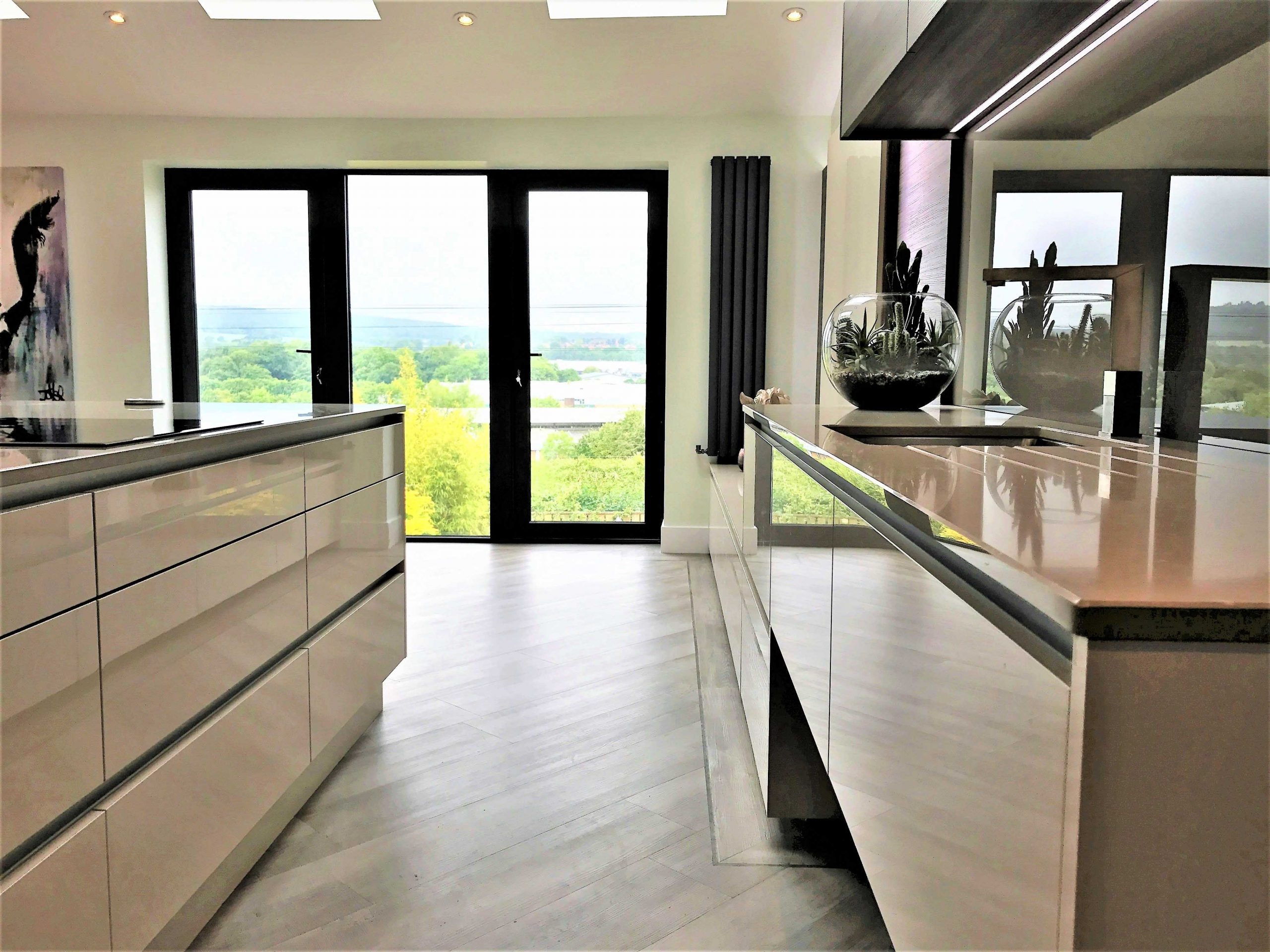 contemporary asymmetric kitchen with cut out detail in island
