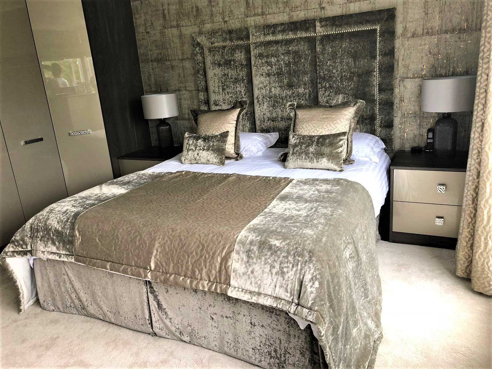 opulent master bedroom with hidden ensuite and built in tv furniture