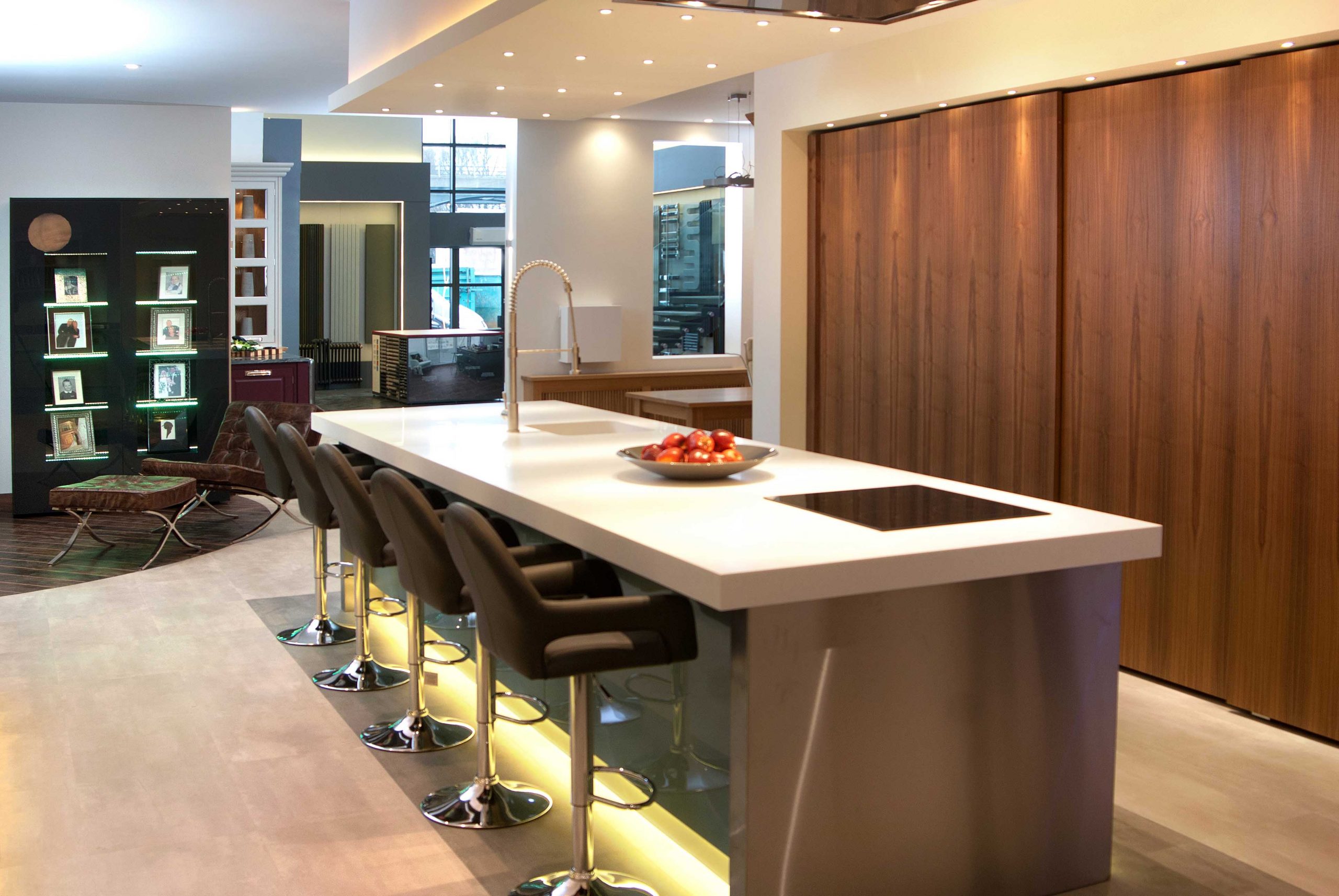 contemporary linear style handleless kitchen featuring pattern match woodgrain detail our showroom