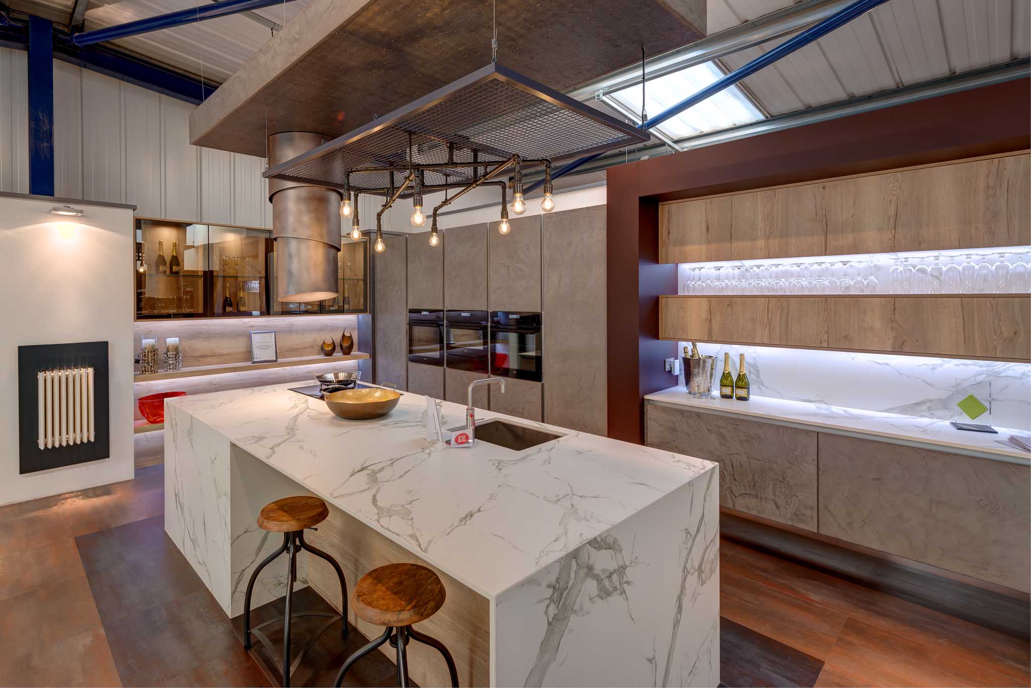 industrial inspired handleless kitchen with pattern matched dekton island our showroom