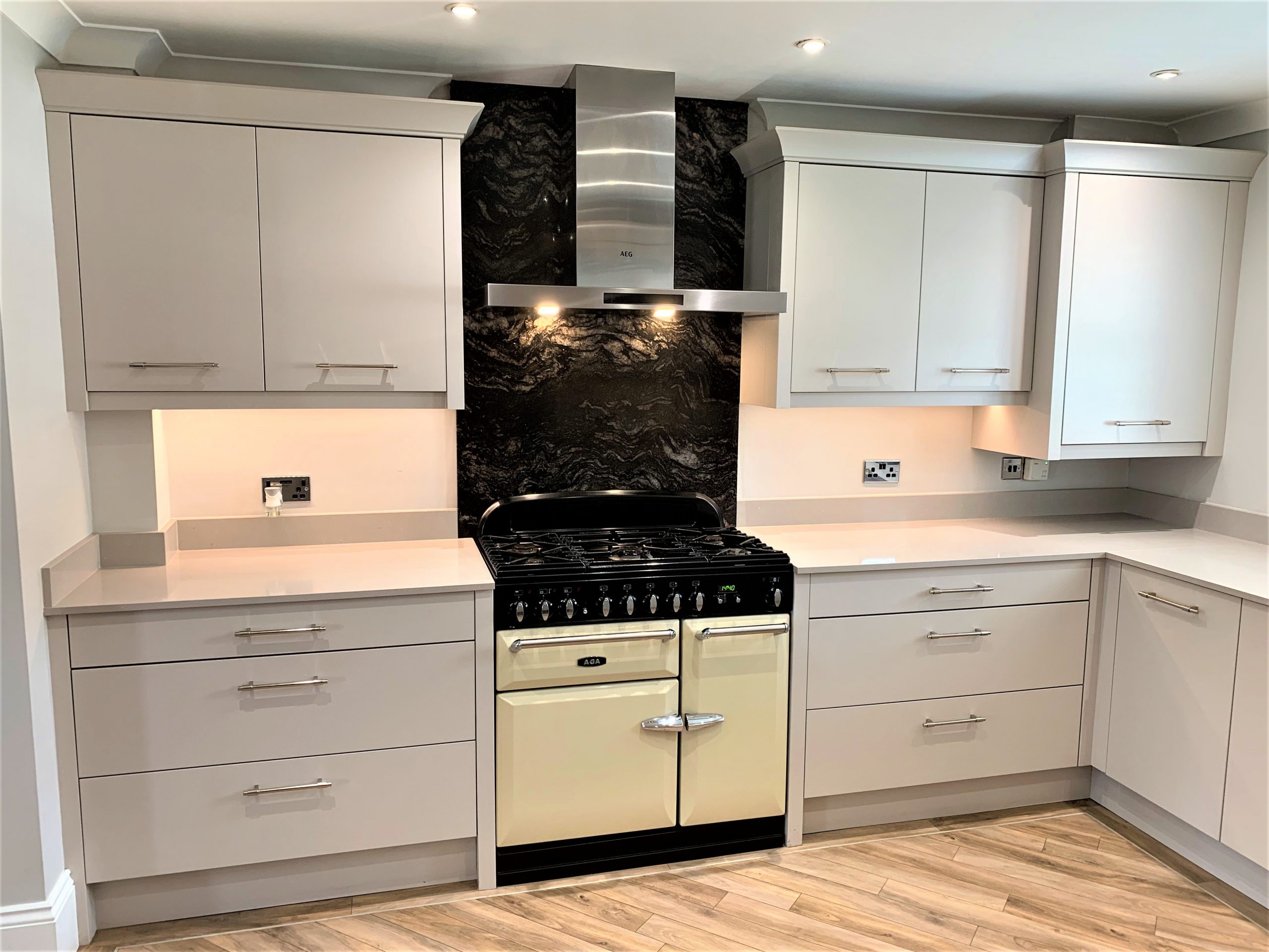town house kitchen and complementing media furniture with oak accent