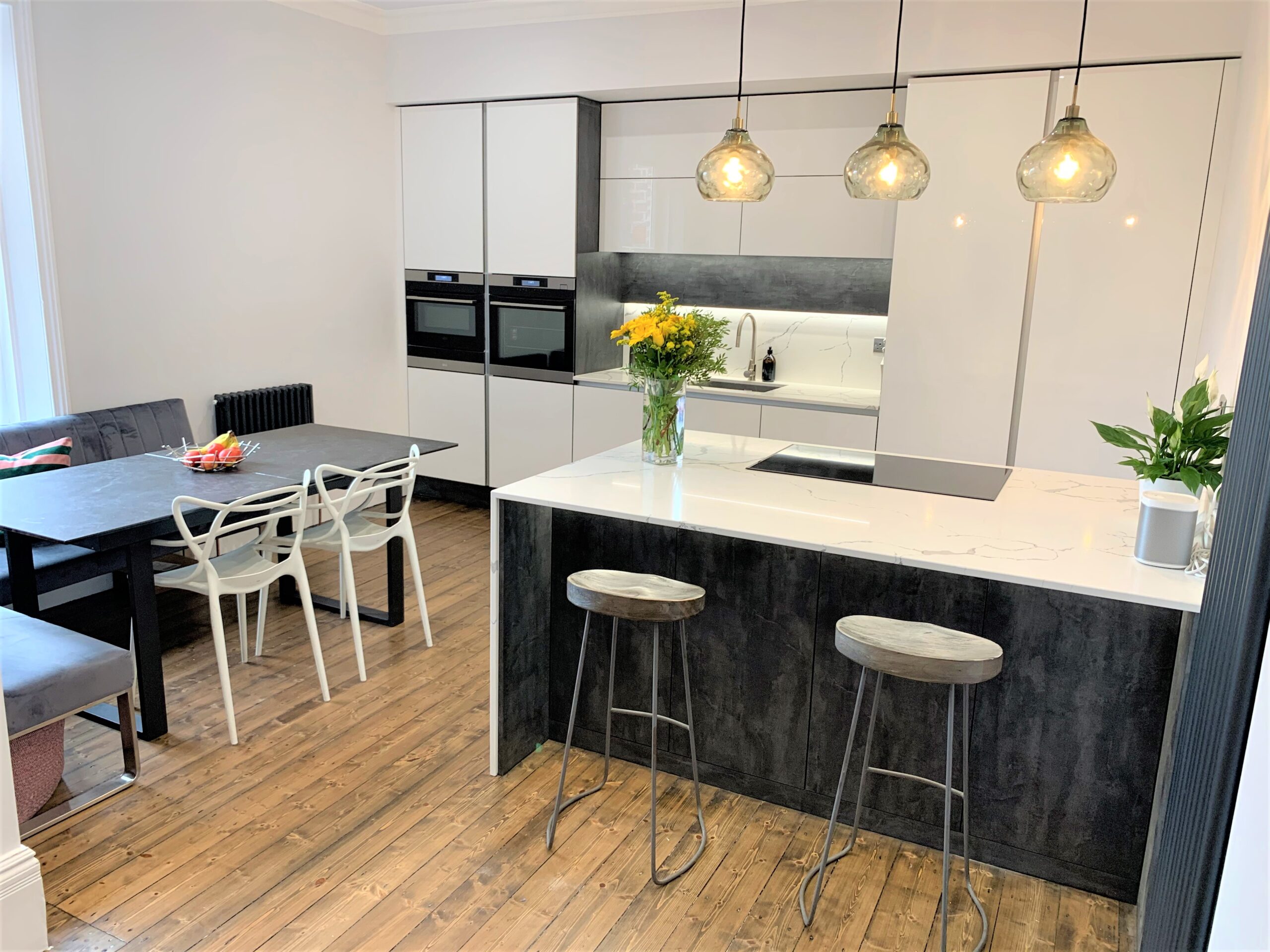 contemporary clean sleek white gloss breakfasting kitchen