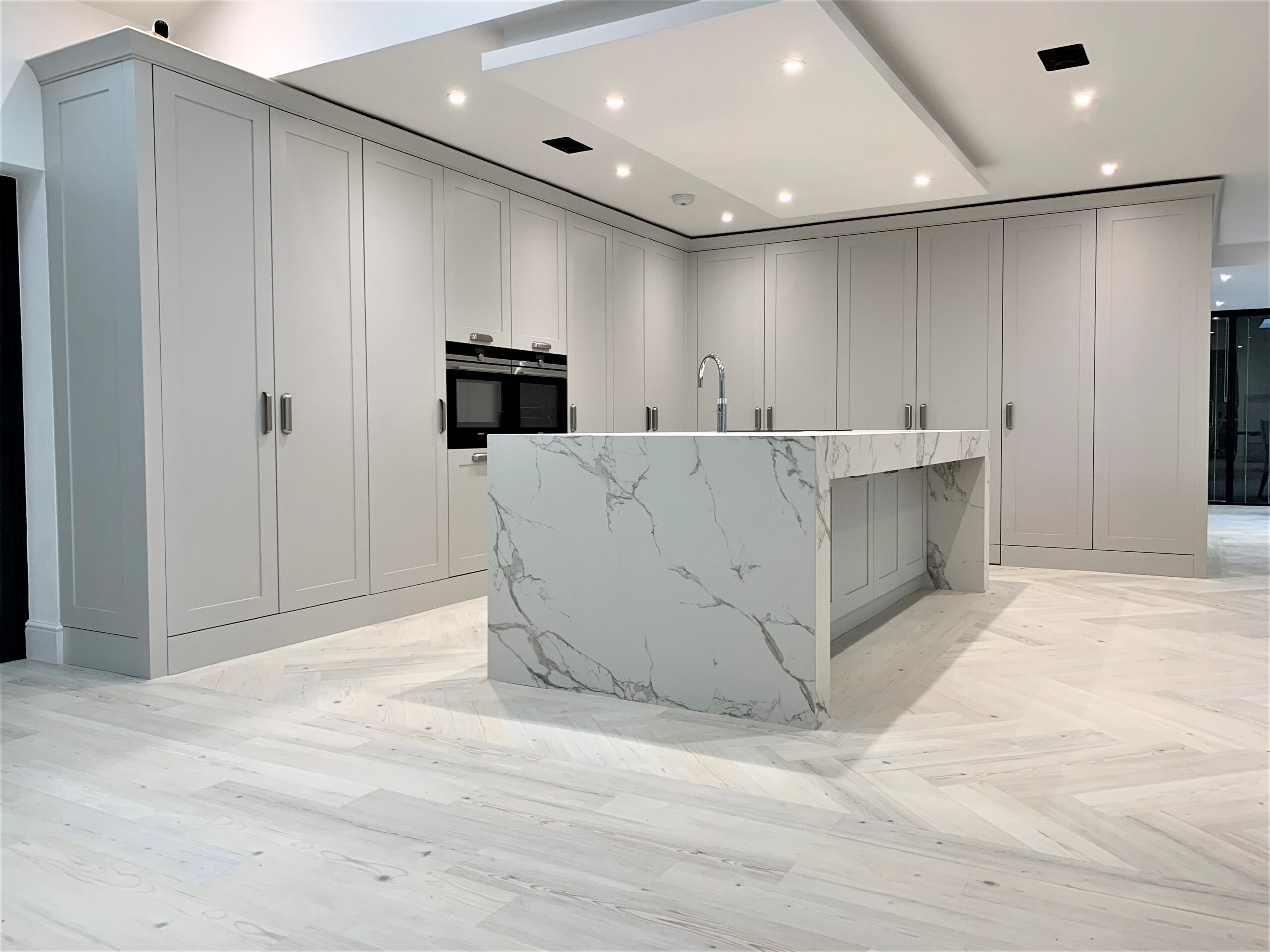 classic contemporary monochromatic breakfasting kitchen and dining
