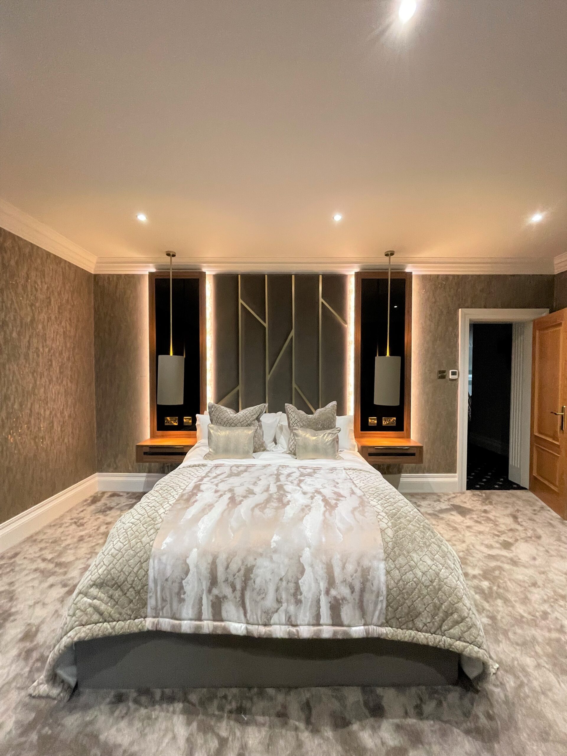 floating effect bedside cabinets in natural Dijon walnut and black glass