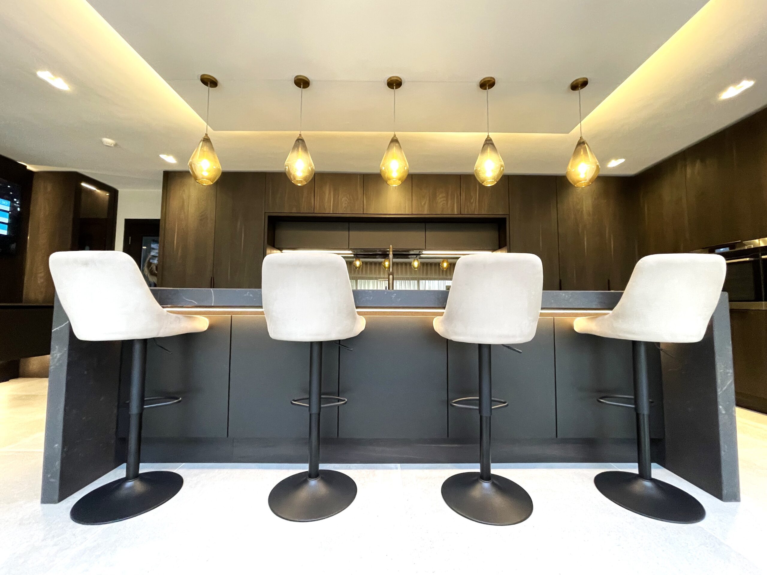 dark dramatic breakfasting kitchen and media furniture