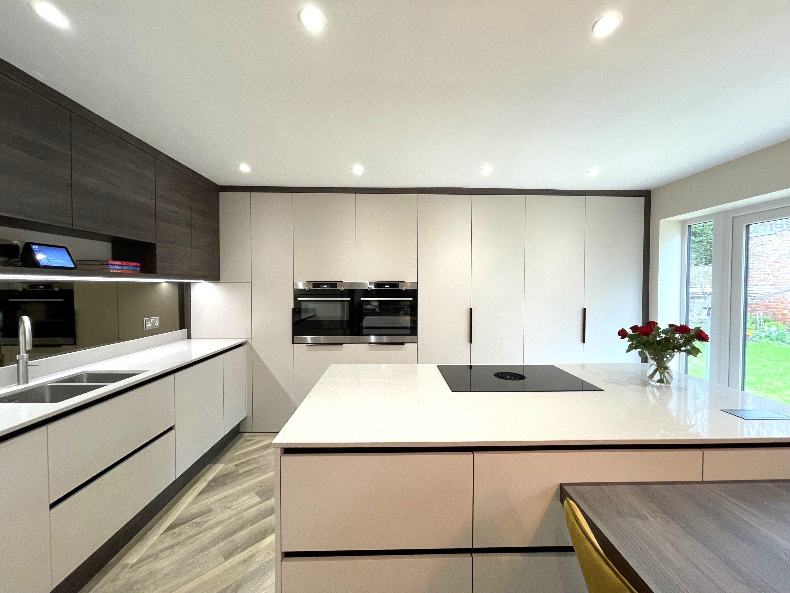 contemporary kitchen and utility with integrated dinning table
