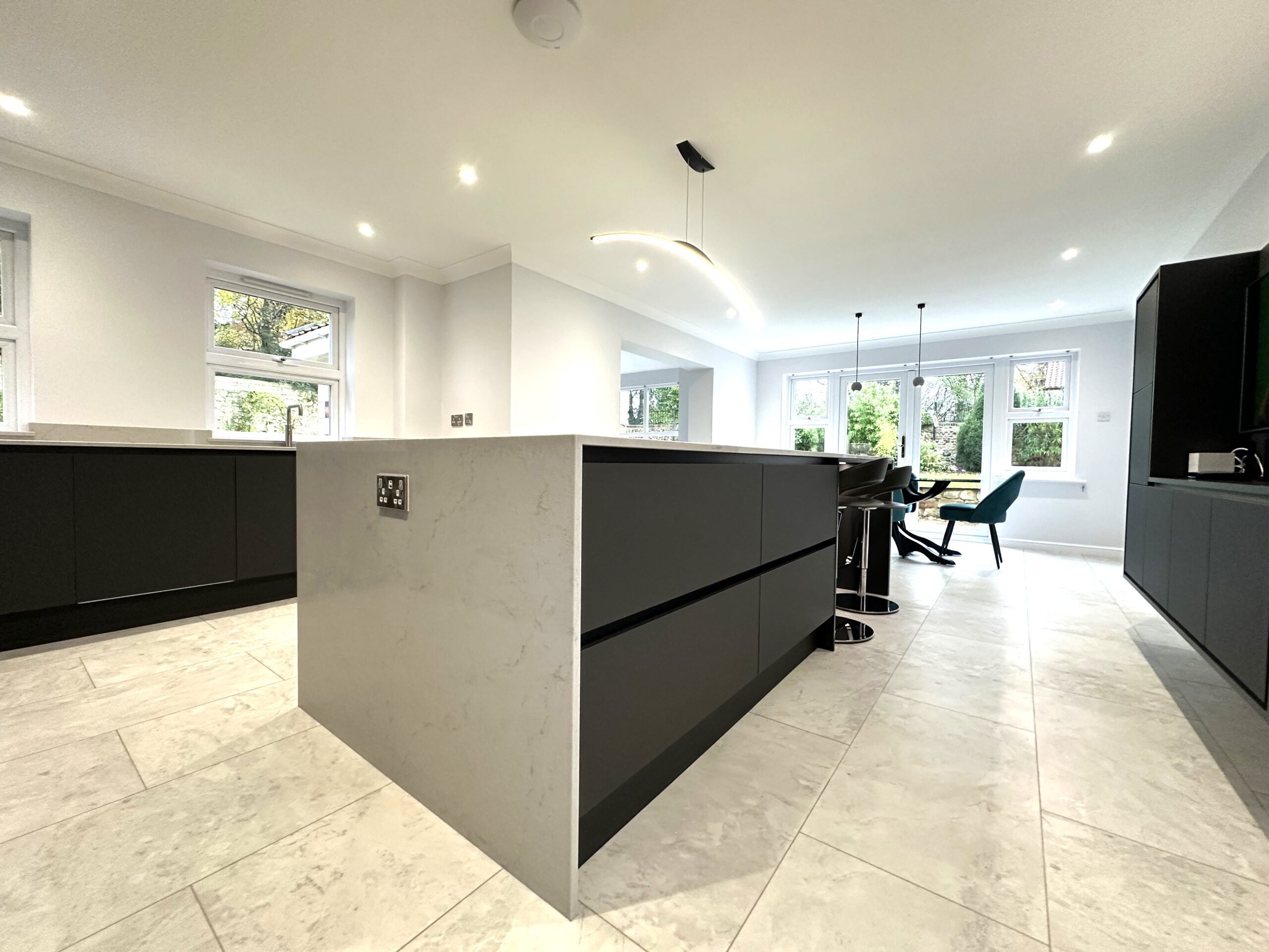urban chic stone and concrete breakfasting kitchen and utility