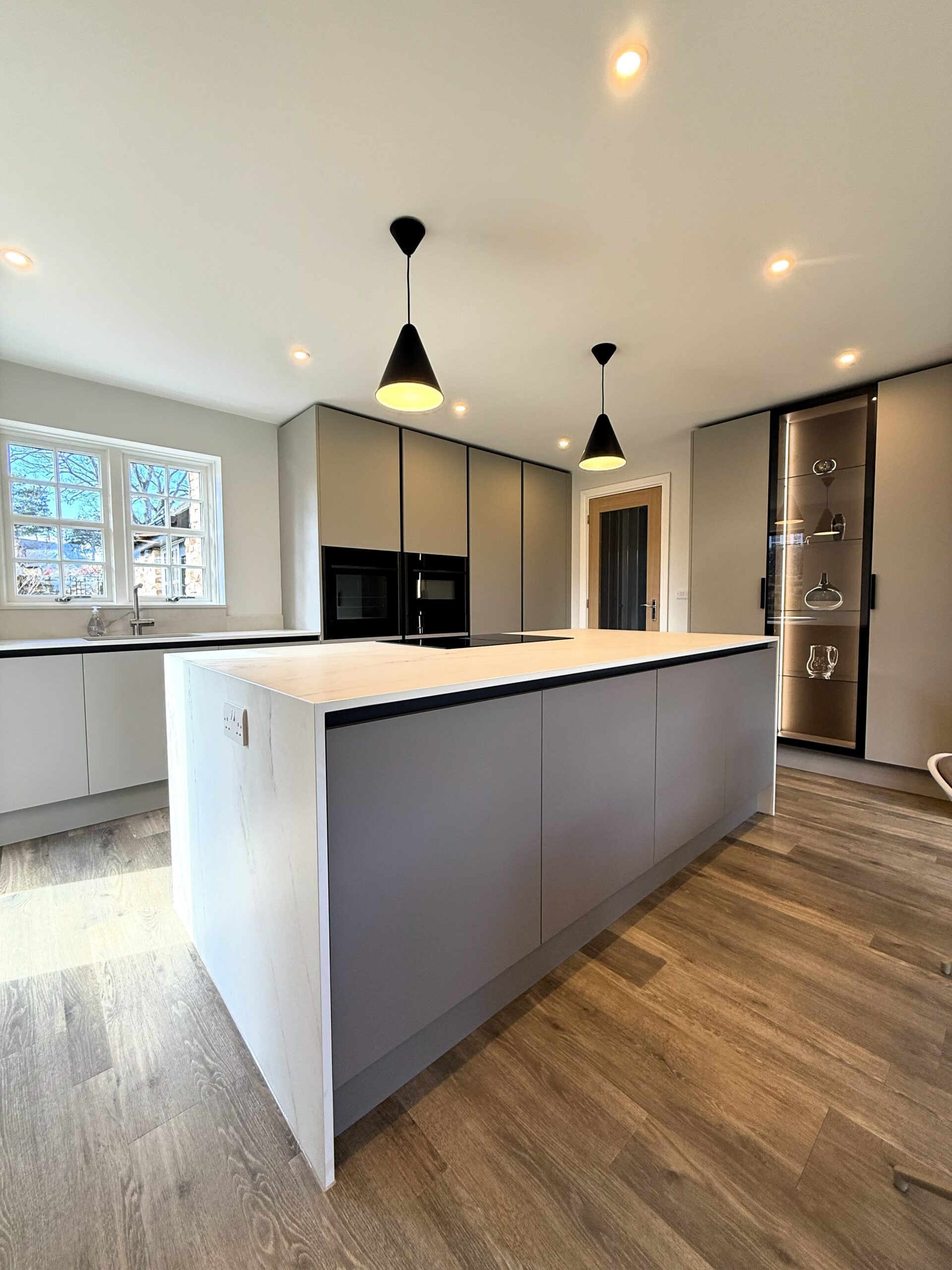 reimagined handleless kitchen dining and pantry