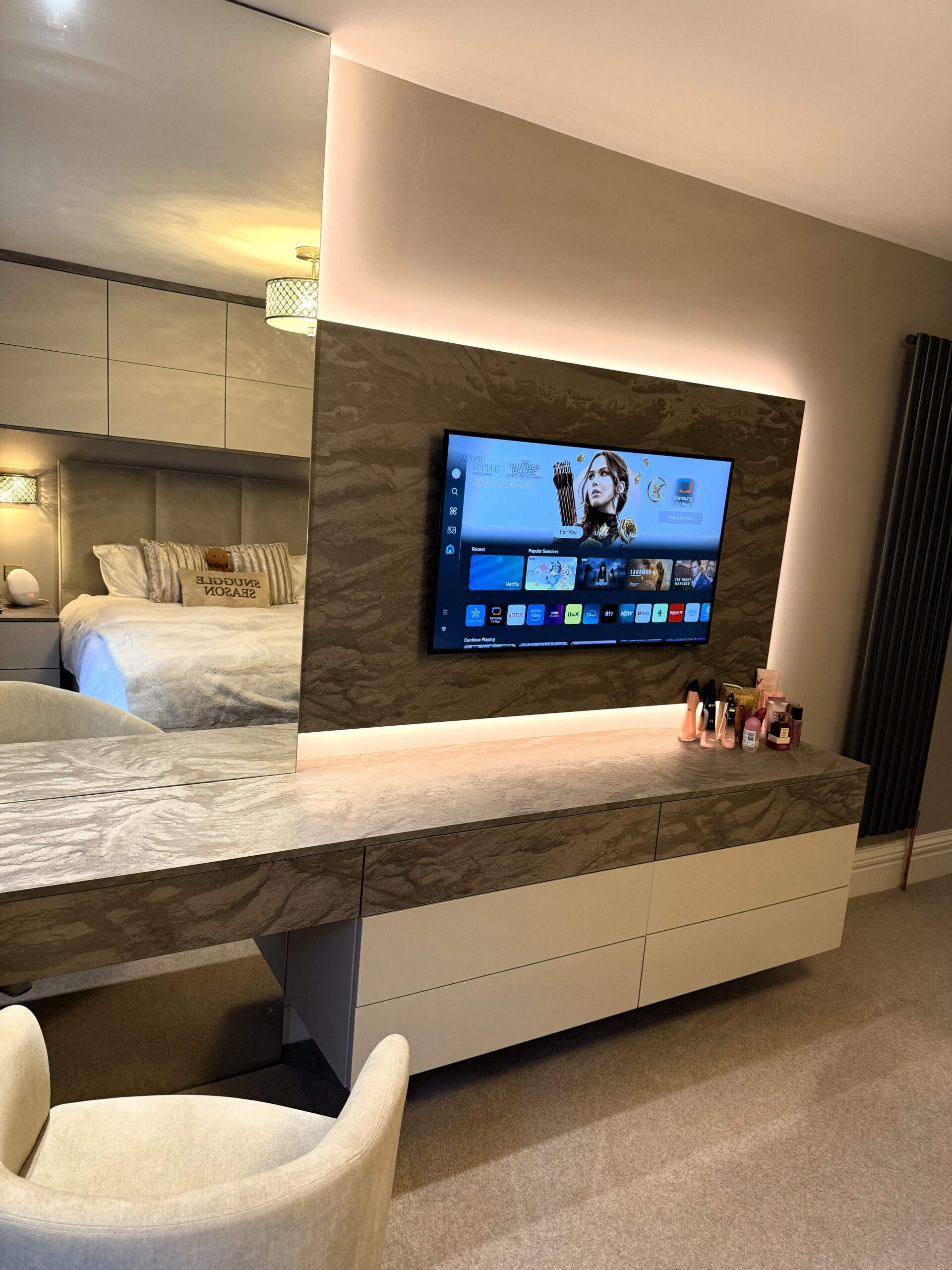 media dressing bedroom with an abundance of storage