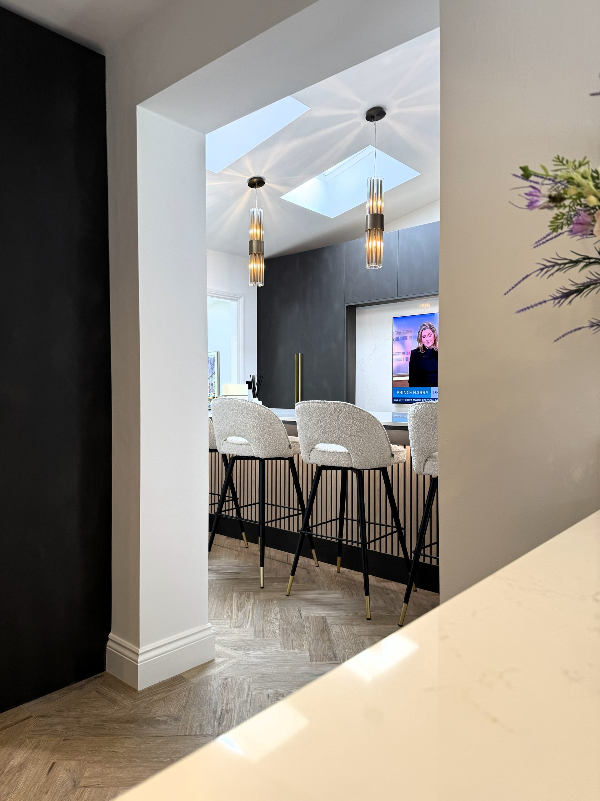 rich contrast bespoke kitchen, media wall and karndean